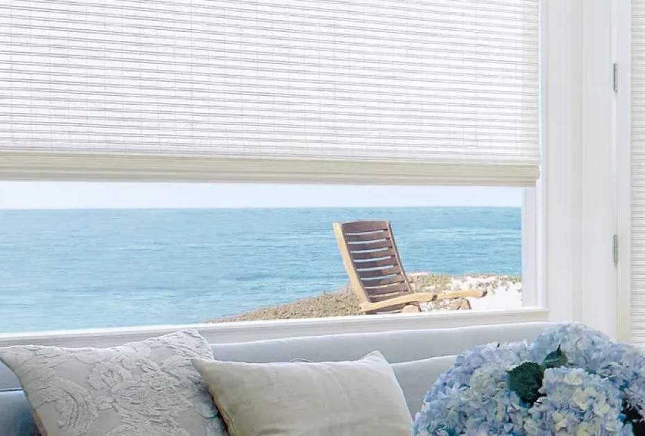 Drapery-window with a view of the ocean