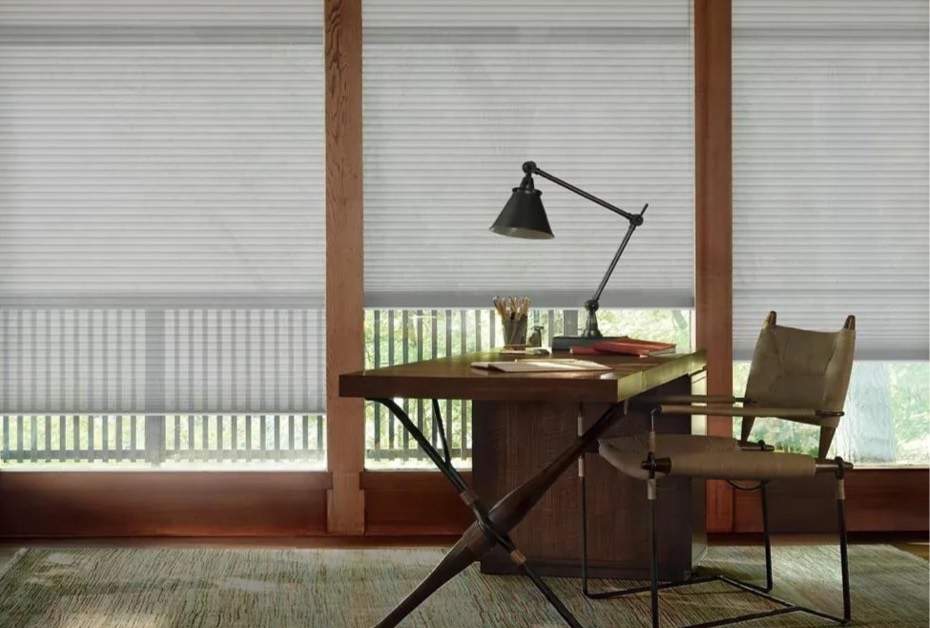 shades with light filtering into an office or study area