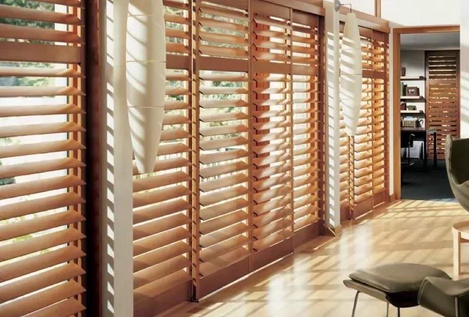 shutters-warm wooden shutters filtering light into a modern room